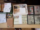 a table with a lot of stamps and other items on it