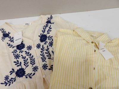 two yellow and white striped shirts with blue flowers on them