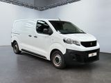 the white van is parked in a large room
