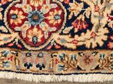 an image of a close up of a rug on a wooden floor