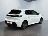 the rear of a white car parked in a garage