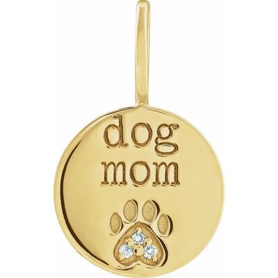 un pendentif en forme de maman chien en or, orné d'une empreinte de patte en diamant