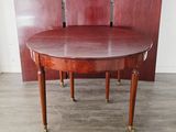 an image of a round dining table with four chairs