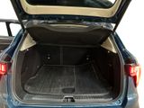 the back of a blue car with its trunk open showing the cargo area