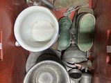 a metal container filled with a lot of dirty dishes