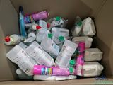 a cardboard box full of baby products and baby wipes