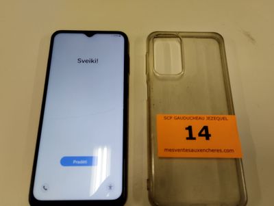une image représentant un téléphone sur lequel est collé un autocollant, à côté d'une boîte