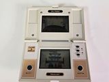 a white nintendo game console sitting on top of a white table