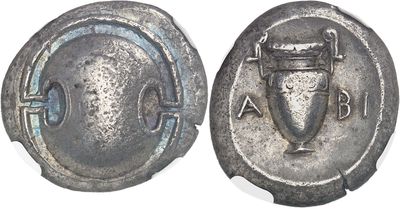 an ancient coin with a shield and a shield on it