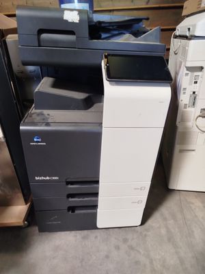 many different types of printers sitting on the floor