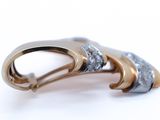 a close up of a brooch with diamonds on it