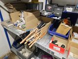 many boxes and tools on a shelf in a room