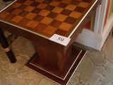 a small table with a chess board on top of it