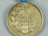 a gold medal with a blue ribbon around it