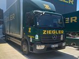 a large truck that is parked in front of a building
