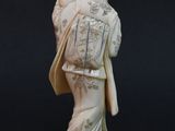 an image of a statue of a man with a bow in his hand