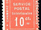 un timbre rouge portant la mention « service postal »