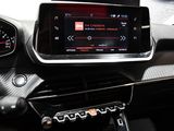 the dashboard of a car with a digital display in the center of it