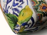 a close up of a purse with a flower design on it