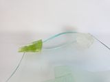 a glass vase with a green piece of glass on it