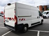 a white van that is parked in a parking lot