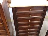 several pieces of furniture including a dresser, chair, and table