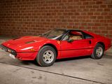 an image of a red sports car parked in front of a brick wall