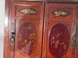 an old wooden cabinet with many drawers in it