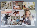 several old movie posters of men and women playing baseball