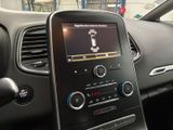 the dashboard of a car with a digital display in the center of it