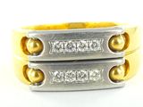 two yellow and white gold wedding bands with diamonds on them