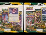 two packs of pokemon trading cards on a black background