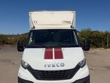 a white van with a red stripe parked in a parking lot