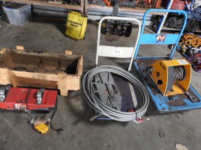 a lot of tools sitting on the floor in the garage