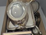 a box of silverware on a table in a room