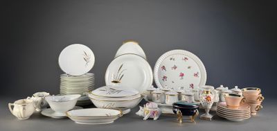 many different types of porcelain plates and bowls on the table
