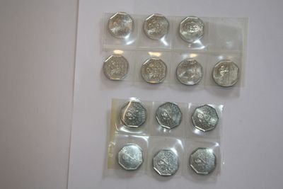 a lot of coins that are on the table
