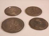 four antique bronze medallions of jesus and mary on a white surface