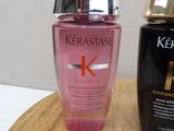 a bottle of kerastase next to a bottle of kerastase