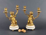 pair of antique brass candlesticks on marble bases with cherenshes