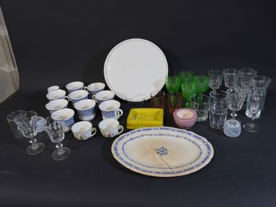 a table with a lot of glassware and plates on it