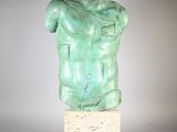 sculpture of a male torso on a marble base