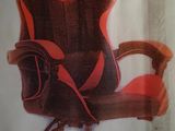 an advertisement for a computer chair with a red and black seat