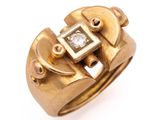 an image of a gold ring with a diamond in it