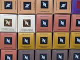 several boxes of different flavored chocolates stacked on top of each other