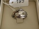 a ring in a box with a price tag on it