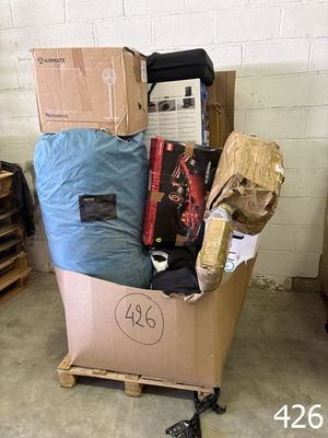 a cart full of boxes and other items in a room
