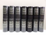 a lot of books that are sitting on a shelf