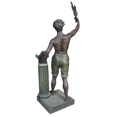 bronze statue of a boy with a bird in his hand