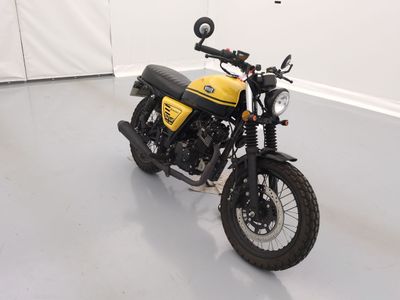 a yellow and black motorcycle parked in a white room